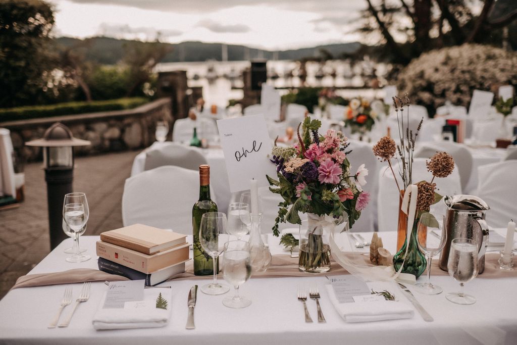 Table Settings at Poet's Cove with ocean sunset behind