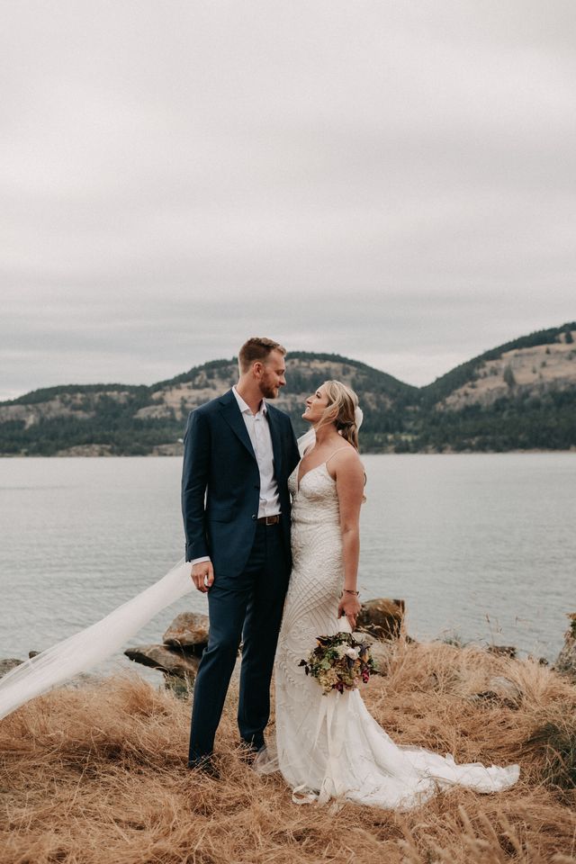 Newlyweds photo in front of ocean on Pender Island