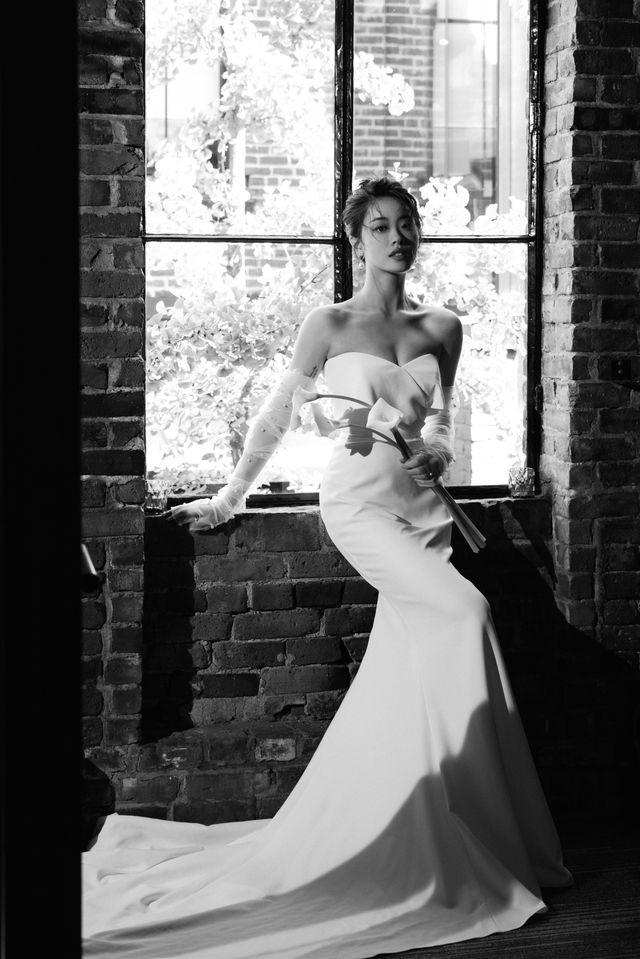 Vancouver bride sits at window by Anastasia Sun 