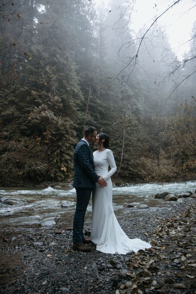 First wedding kiss in BC rainforest by Kassy Davis