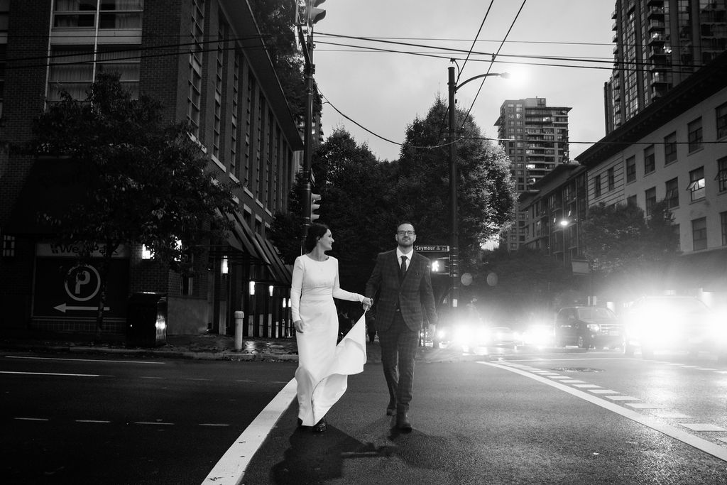 Newlyweds walk down rainy Vancouver street