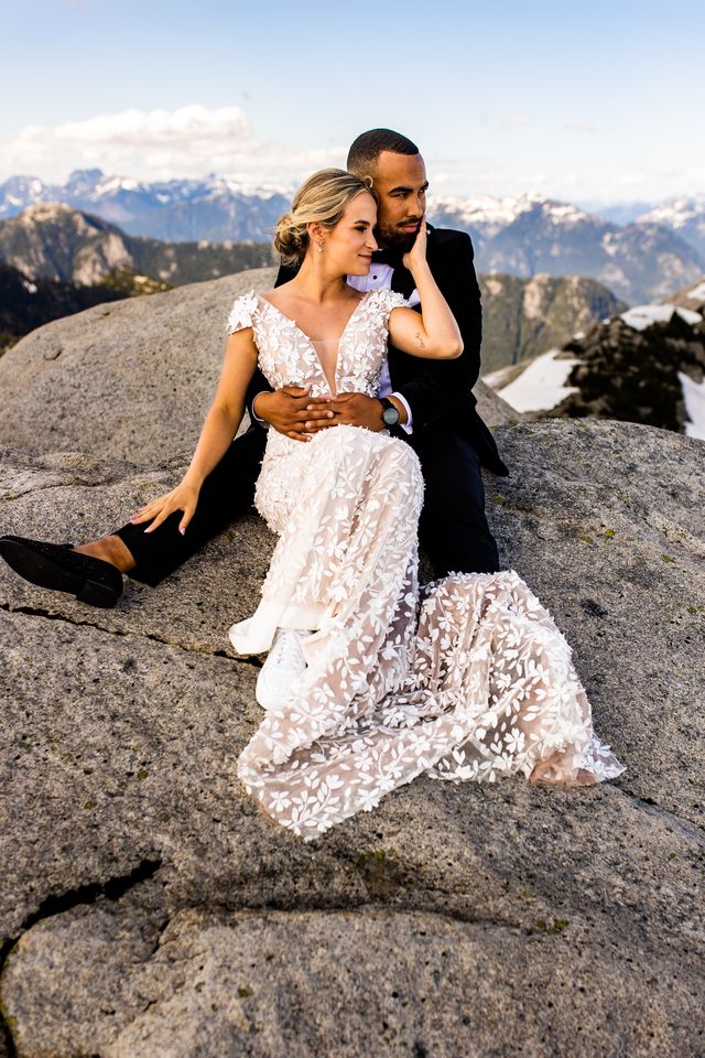 Newlyweds on top of mountain by Esther Moerman