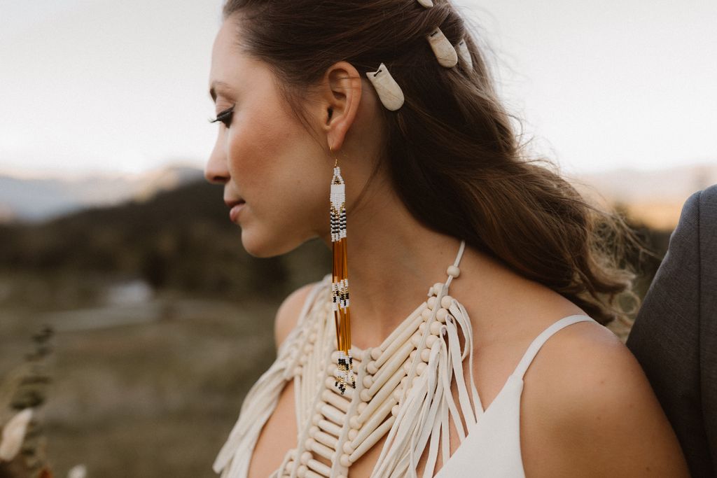 Indigenous bride with white beaded necklace