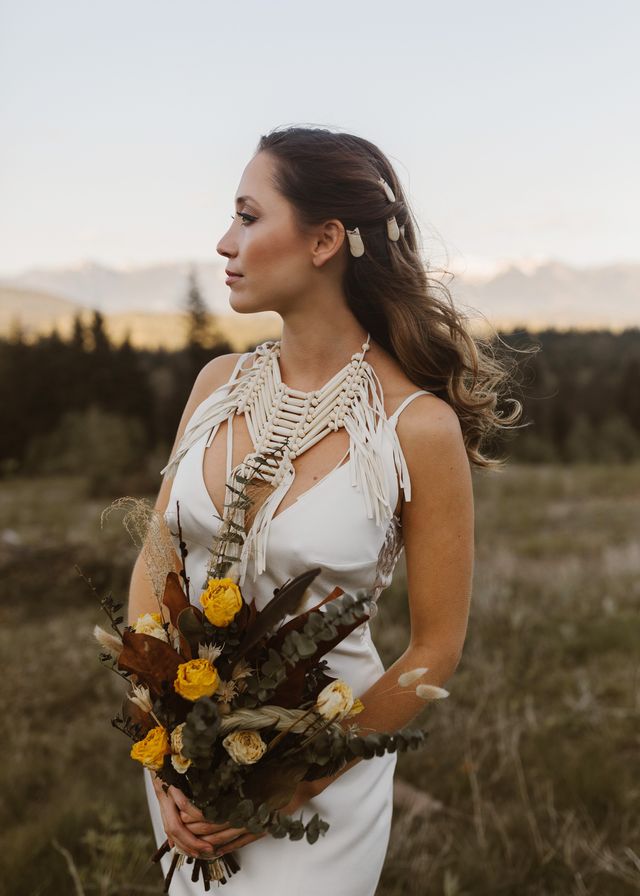 Indigenous bride holding bouquet 