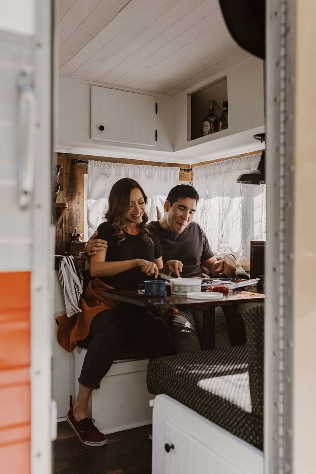 engagement shoot couple inside vintage trailer