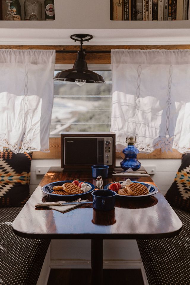 pancakes on blue plates inside retro trailer