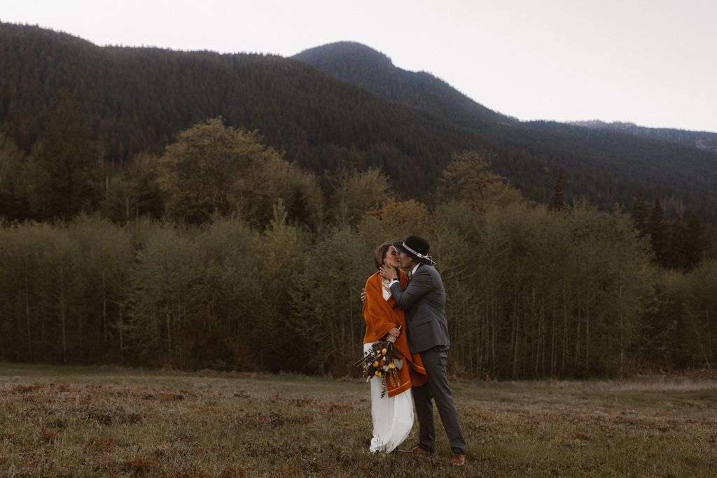 Indigenous newlyweds in field by Jen + Brian Photo and Film