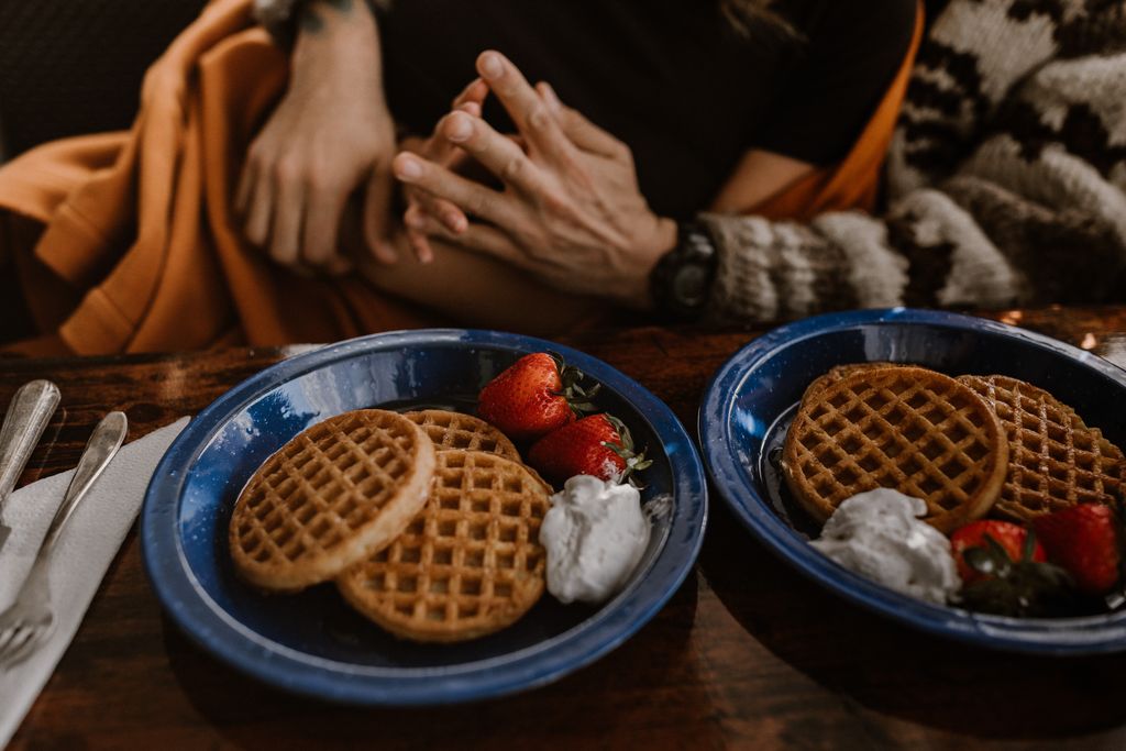 engagement ring above pancake breakfast with strawberries