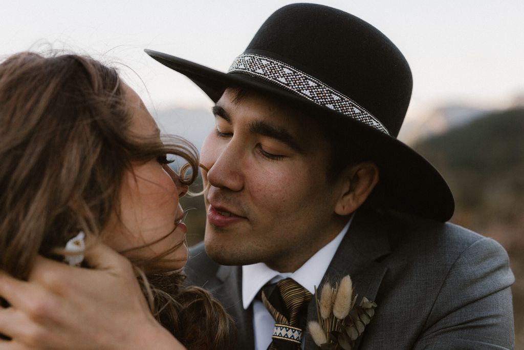 An eloping couple kiss after traditional Cree ceremony