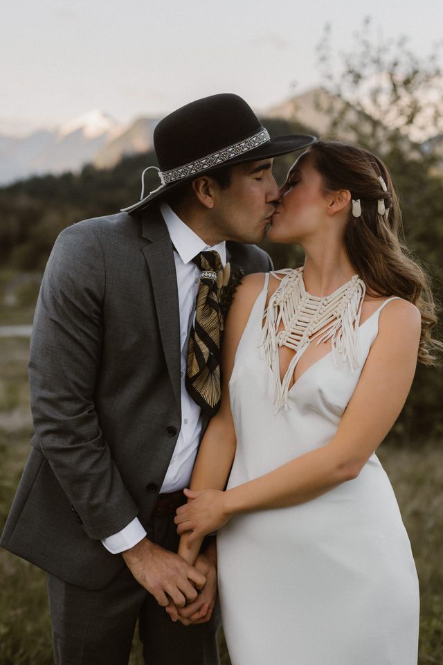 Eloping couple kiss after ceremony