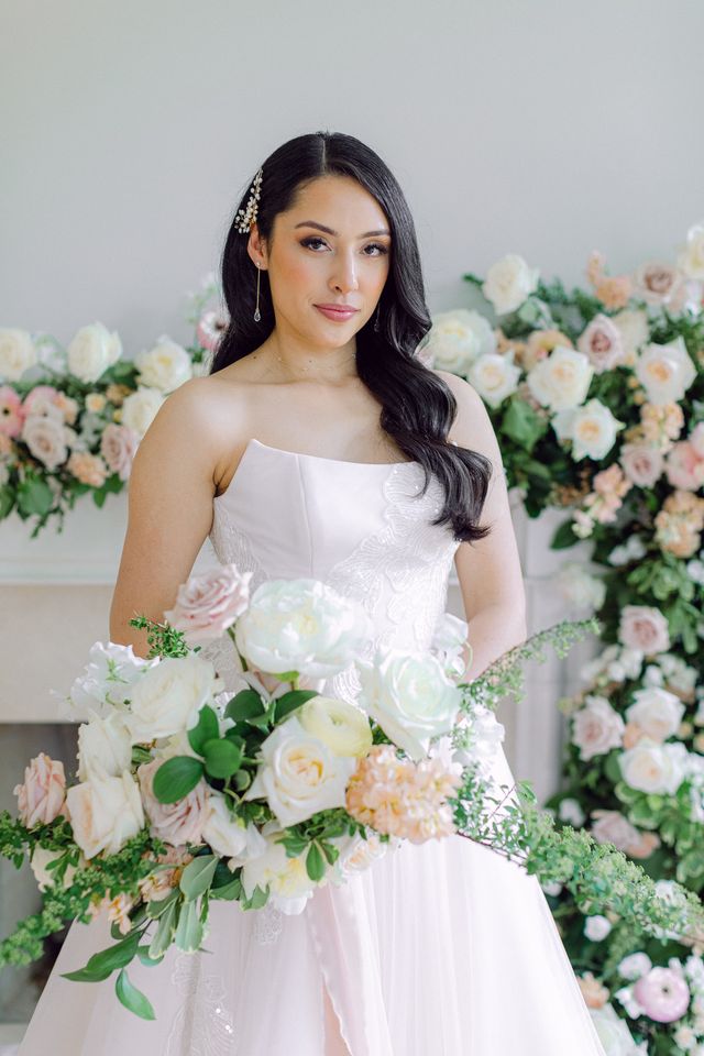 Bride holds blush and white bouquet