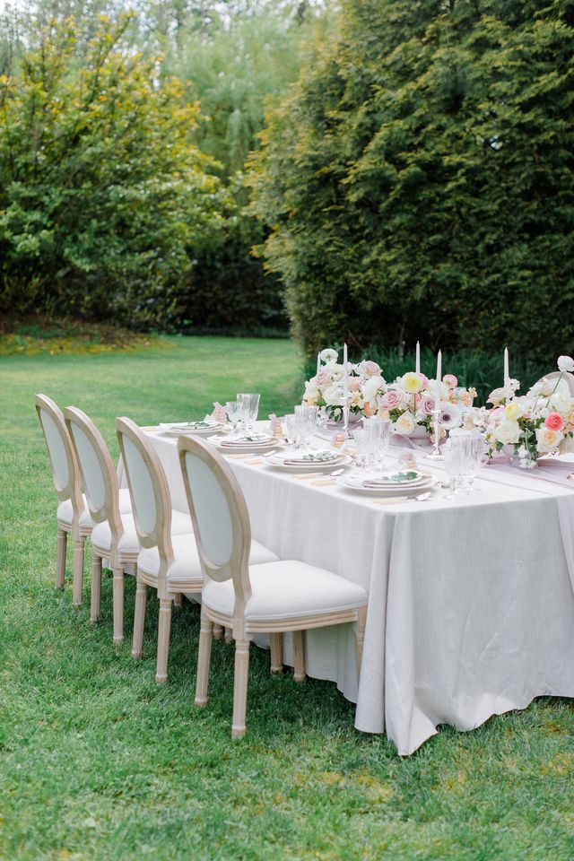 Reception table in blush and pink in outdoor garden