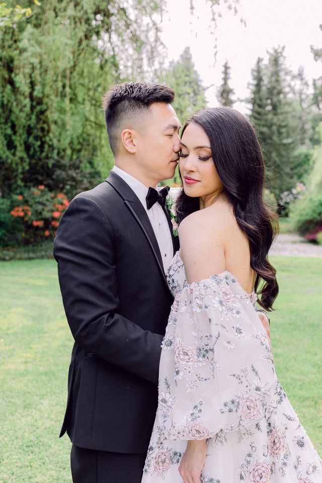 Newlyweds with bride in floral gown