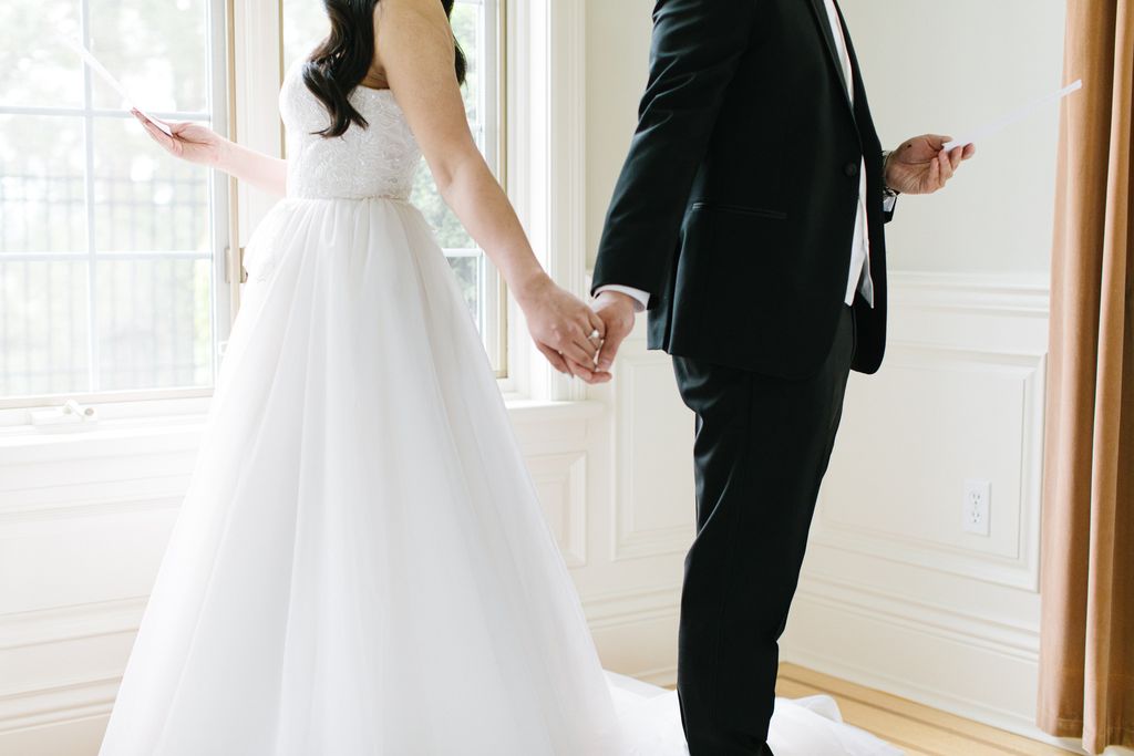 Newlyweds hold hands