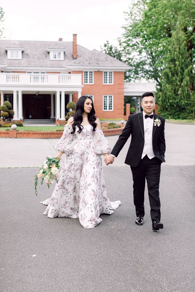 Newlyweds walk along lane