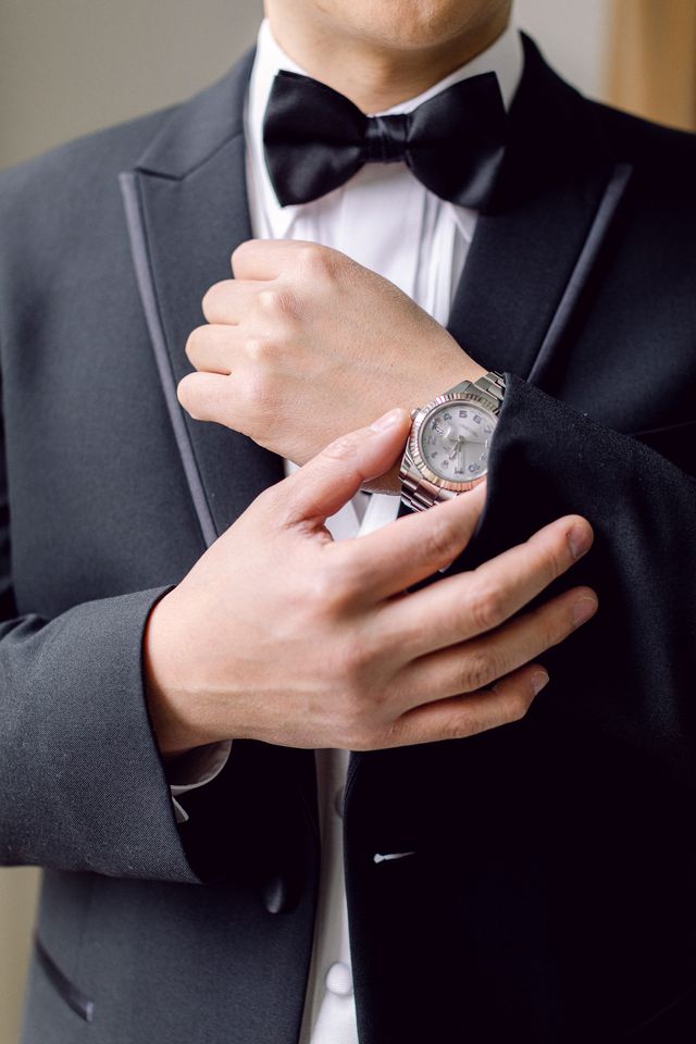 Groom shows off Rolex watch