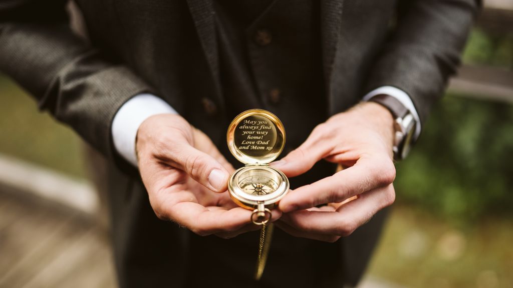 Groom holds ring