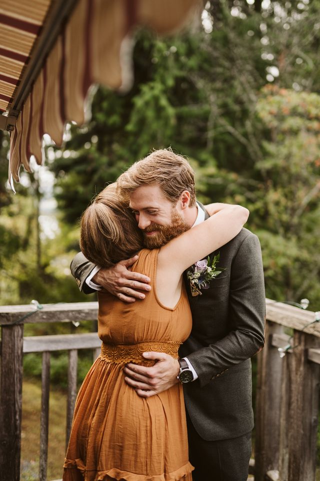 Groom hugs mother by Aly Sibley