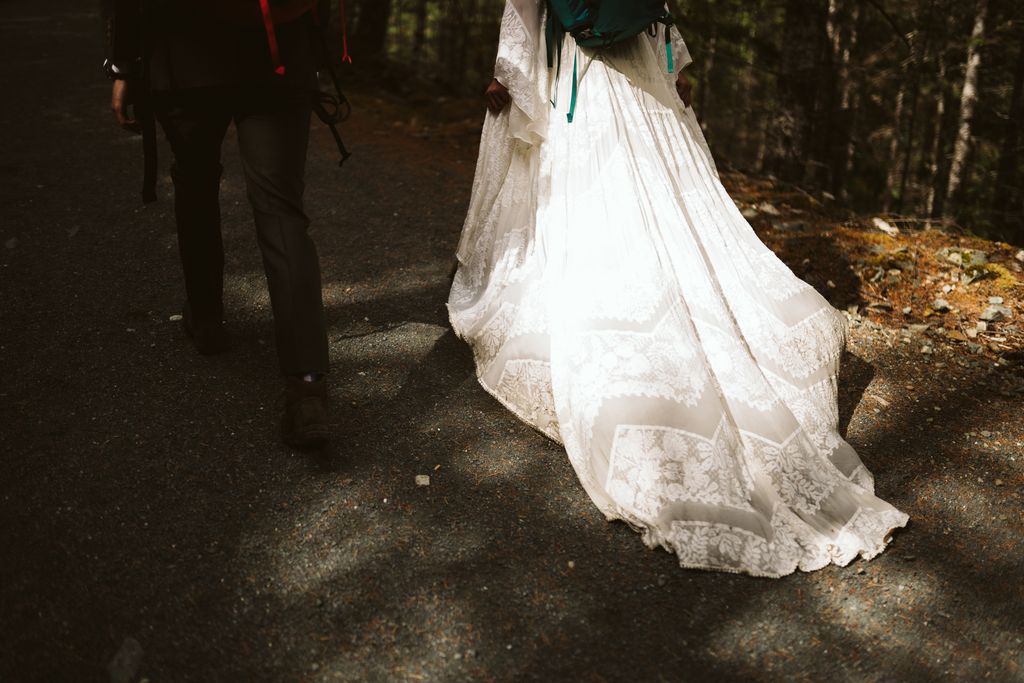 Wilderness + Waterfalls Wedding bride's gown over stairs