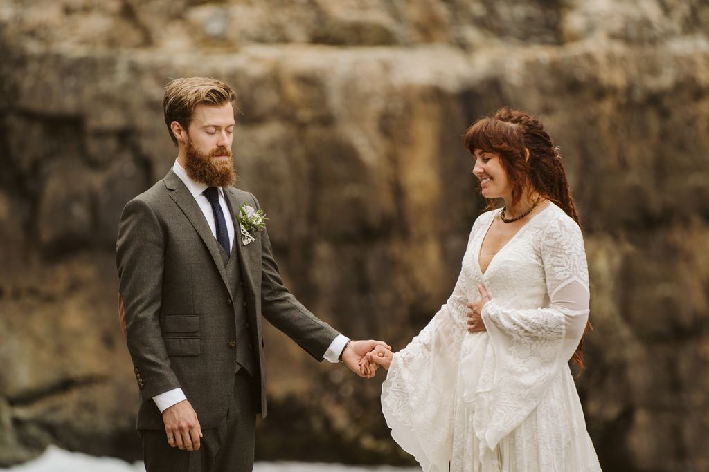 Bride and groom laugh during ceremony