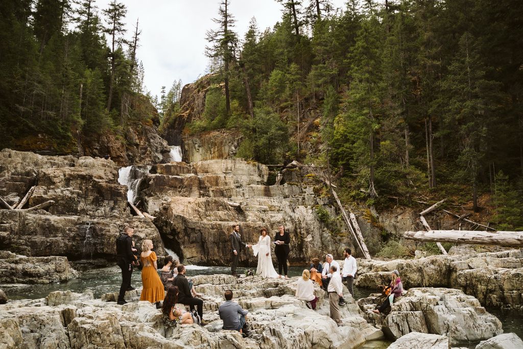 Newlyweds climb beach cliffs by Aly Sibley