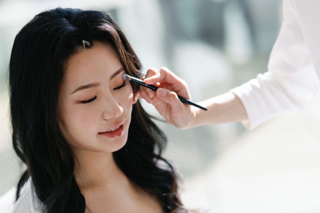 bride has makeup applied at Paradox Vancouver