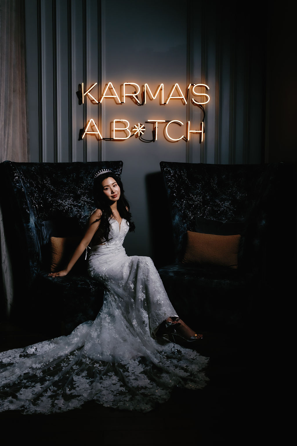 bride sits looking out at lights in Paradox Vancouver