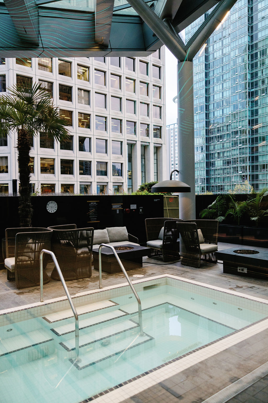 pool area with view at Paradox Vancouver Hotel