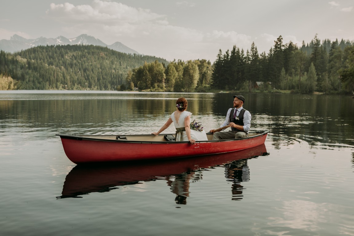 Tyax Lodge Lakeside + Mountain Weddings couple in canoe