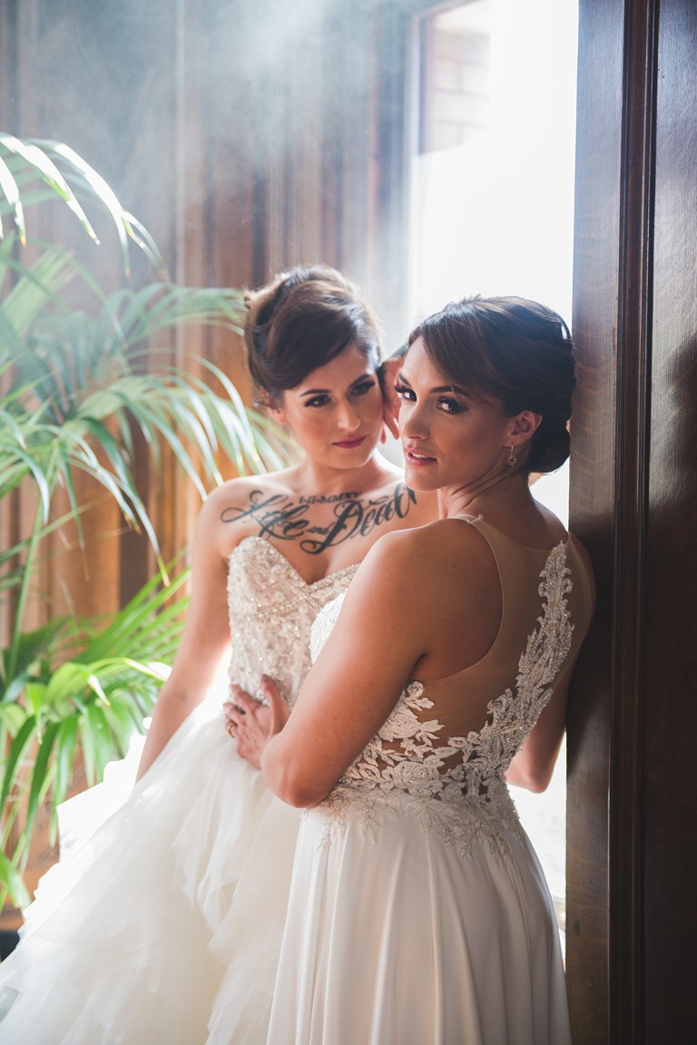 two brides with updo hairstyles at The Fairmont Empress