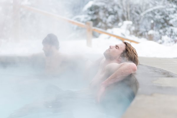 Man relaxes in Tyax Lodge Spa pool