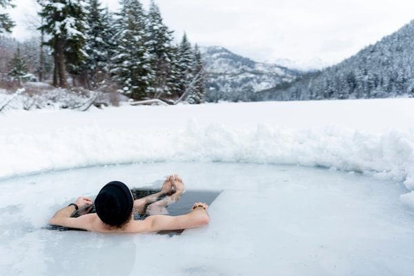 Man in cold plunge at Tyax Lodge 